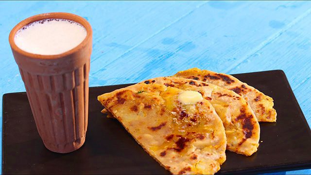 Have a taste of the local food, Parathas, with Lassi