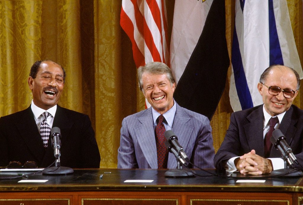 Egyptian President Anwar Sadat, United states President Jimmy Carter and Israeli Prime Minister Meacham Begin, celebrate after signing the Camp David Peace Accords 1978
